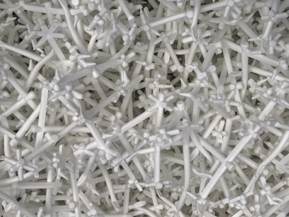 Close-up of white plastic moulding scrap ready for recycling